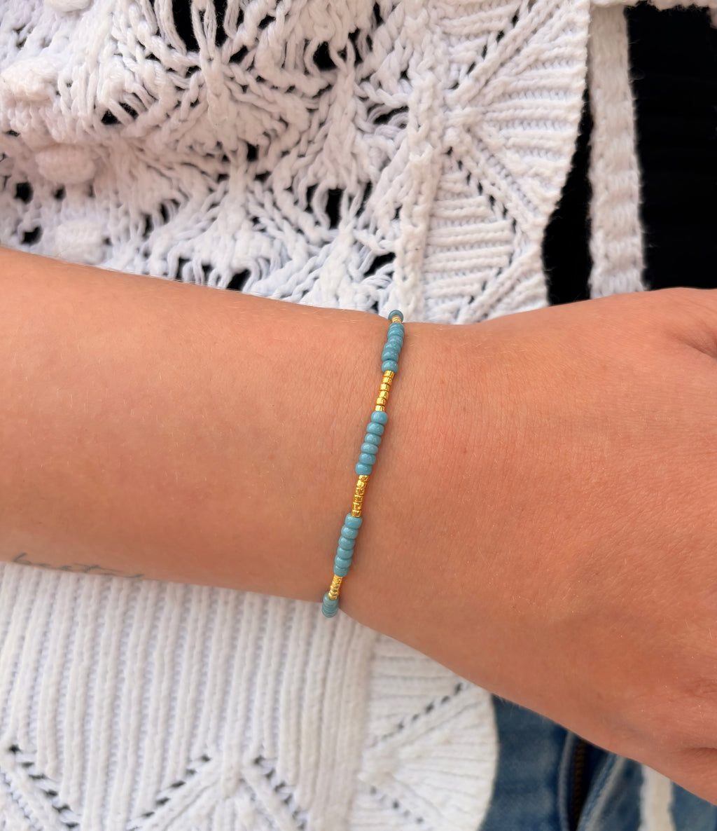 Blått armbånd (elastisk strikk)